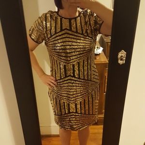 Gold and black knee length dress